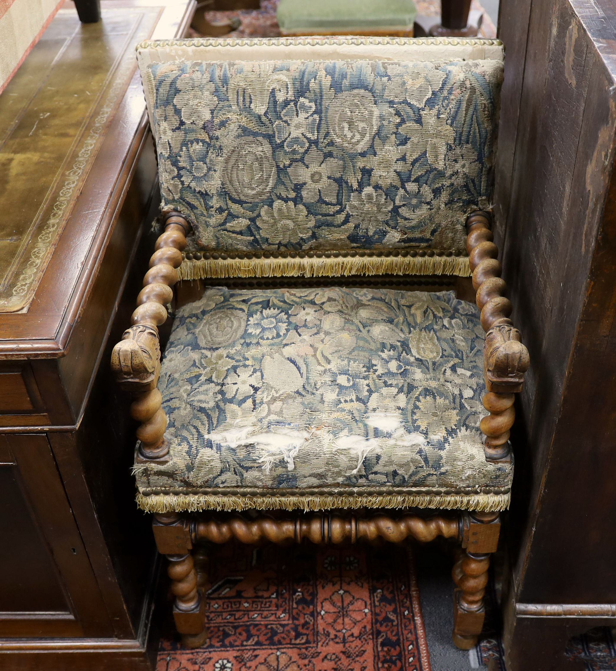 A pair of Louis XIII walnut fauteuils, recovered with 17th/18th century verdure tapestry to the seats and backs., Provenance – Sotheby’s, Paris, European Private collection sale, 16th April 2003, lot number 51